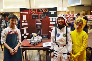 Students from Quail Valley Middle School show off their Mars Rover, RBJ-2000, entered in the freeform category. | Aisha Bouderdaben/The Daily Cougar