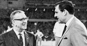 Former UH basketball coach Guy V. Lewis (right) was instrumental in getting UCLA head coach John Wooden (left) to agree to a battle between the two best teams in the country. After 52,000 fans came to the Astrodome to view the first nationally televised regular season game, the contest became known as The Game of The Century. | Courtesy of UH Athletics