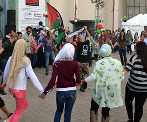 Festival patrons engaged in traditional Palestinian style dance. One of the goals of the festival was to break the negative stereotypes of Palestinians and Palestinian culture. | Aisha Bouderbaden/The Daily Cougar