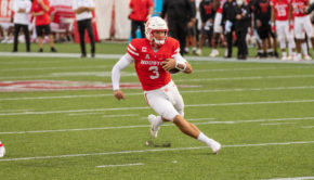 Houston quarterback Clayton Tune avoids defenders as he approaches the end zone for a 26-yard touchdown against USF during the 2020 season. | Trevor Nolley/The Cougar