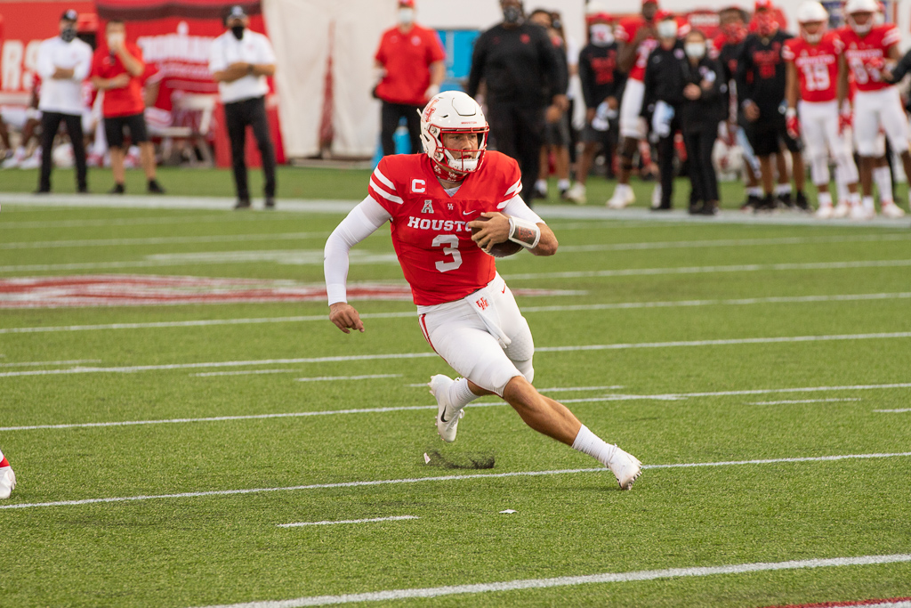 UH quarterback Clayton Tune avoids defenders as he approaches the end zone for a 26-yard touchdown against USF during the 2020 season. | Trevor Nolley/The Cougar