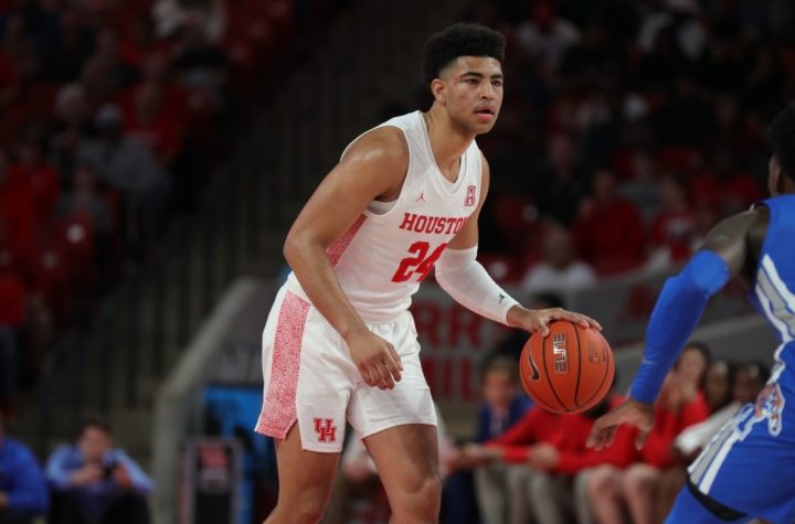Houston guard Quentin Grimes holds the ball at the top of the key as he awaits for the Cougars' offense to develop against Memphis during the 2019-20 regular-season finale. With the postponement of UH and USF, the Cougars’ next game is against UCF on Sunday. | Mikol Kindle Jr./The Cougar