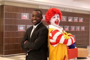 Student Government Association President Cedric Bandoh poses with Ronald McDonald during a fun-filled day at the Dining Services' open house.