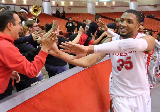 Junior frward TaShawn Thomas and the Cougars took a victory lap after a signature victory against No. 17 Connecticut.  |  Courtesy of UH Athletics