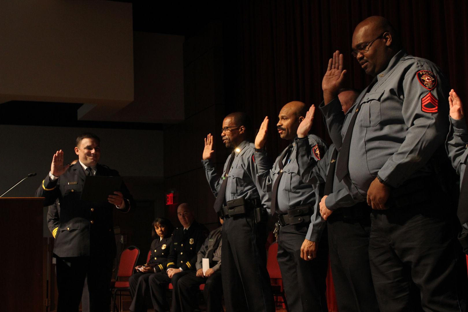 Police officers get sweared in on Friday's Badge Pinning Ceremony. | Greg Fails/The Cougar