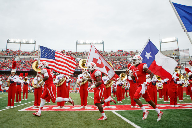 UH honored all branches of the Armed Forces as they ran out of the tunnel, waving flags with the standard of each branch. | Justin Tijerina/The Cougar