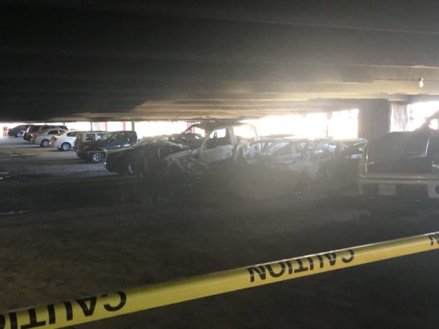 Several vehicles were burnt on the third floor of the East Garage. University officials were asking students to move their cars away from the scene. 
