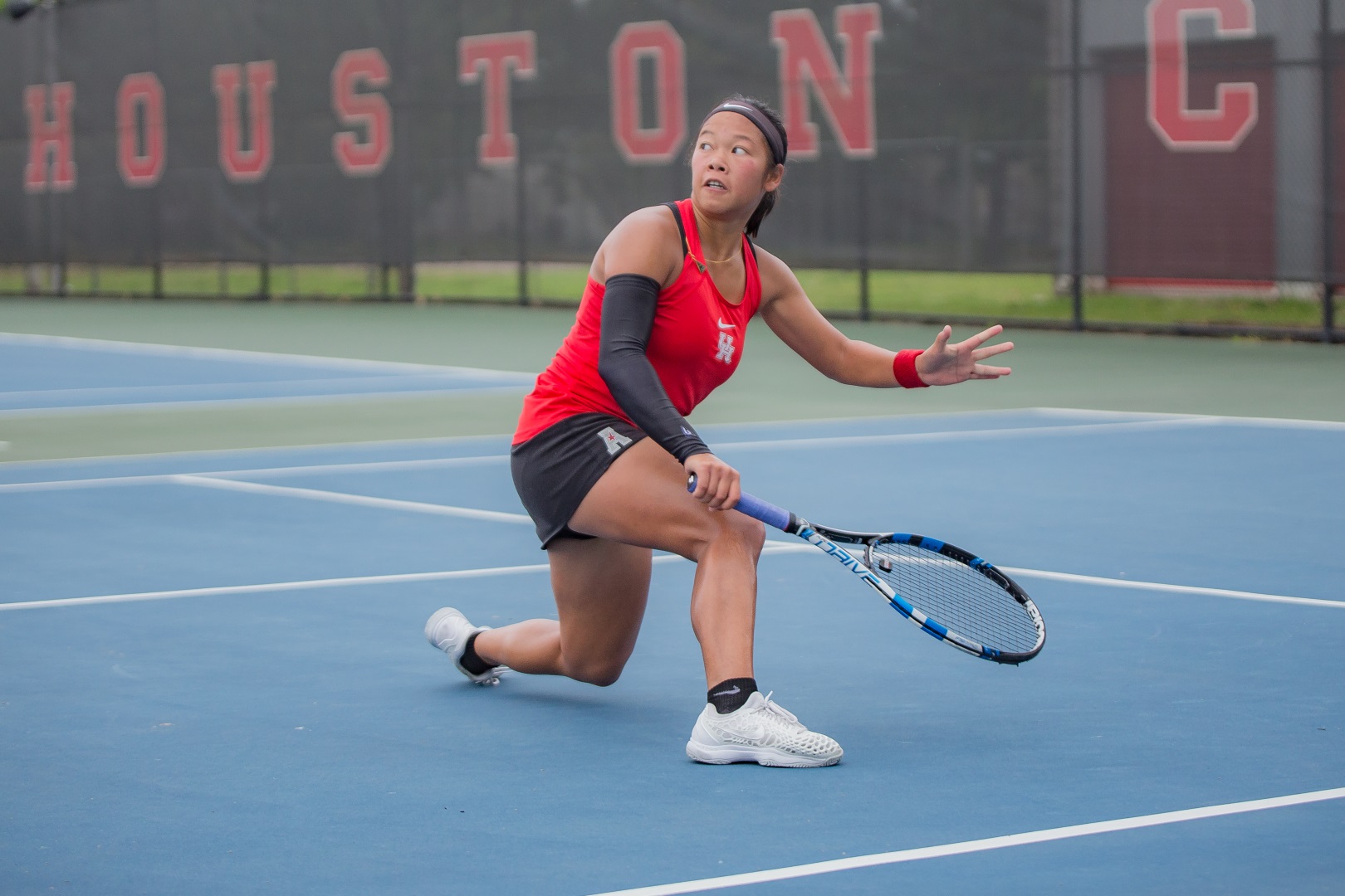 UH tennis senior Phonexay Chitdara, who played key stretches for the Cougars over the weekend, stretches for the ball in a match in 2019. | File photo
