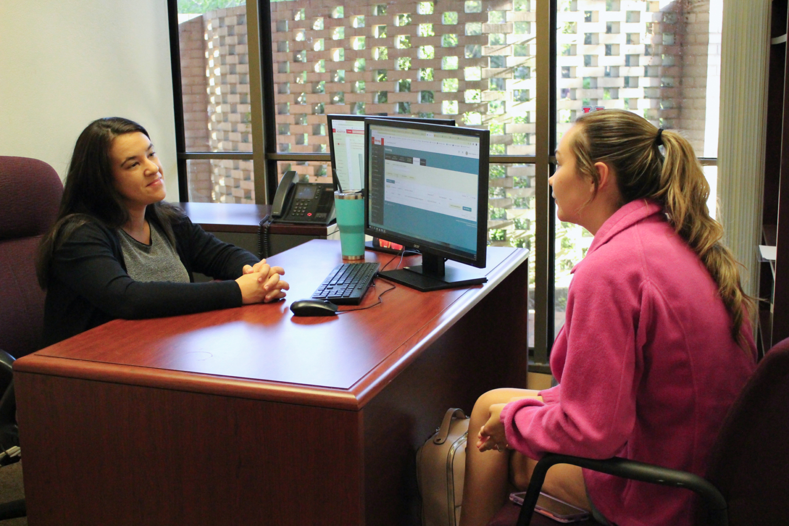 A student talking to an adviser at University Career Services' office. UCS offers career counseling and jobs opportunities to students. | Donna Keeya/The Cougar