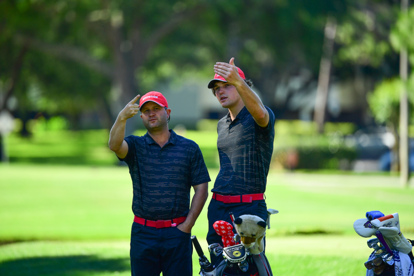 Head coach and director of golf Jonathan Dismuke (left) is going into his 10th year with Houston. | Courtesy of UH athletics