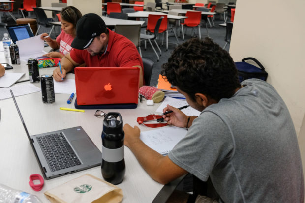 Students and professors debate over whether owning personal laptops is important in college, and if it's possible to get by without one. | Kathryn Lenihan/The Cougar