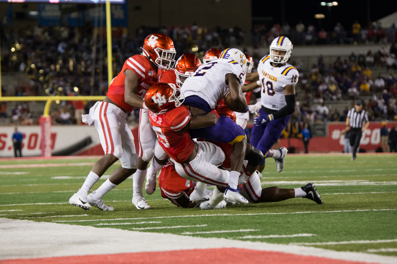 UH football defenders surround a Prairie View A&M offensive player during a game in the 2019 season at TDECU Stadium. This contest was the Cougars' home opener a year ago. Houston's 2020 home opener will be against Tulane after the numerous cancellation to start the campaign. | Trevor Nolley/The Cougar