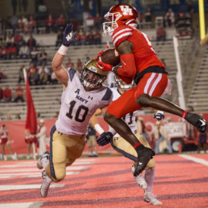 UH receiver Marquez Stevenson skies over Navy safety Kevin Brennan in the end zone during the 2019 season at TDECU Stadium. | Trevor Nolley/The Cougar