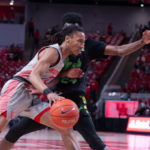 UH men's basketball guard Caleb Mills drives through the lane with a USF defender right on his side. He was the scoring leader for Houston in 2019-20 averaging 13.2 points per contest. | Kathyrn Lenihan/The Cougar