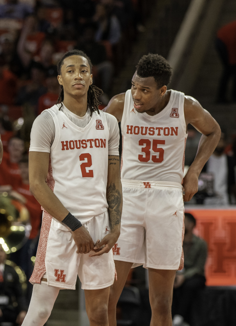 Redshirt freshman Caleb Mills, left, scored 19 straight points to start the second half, while junior forward Fabian White Jr., right, finished with eight points and seven rebounds in the win against Tulsa. | Katrina Martinez/The Cougar
