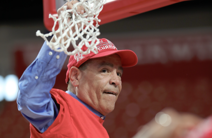 Kelvin Sampson cutting down the nets on March 8 after Houston clinched a share of the AAC regular season championship. | Mikol Kindle Jr./The Cougar