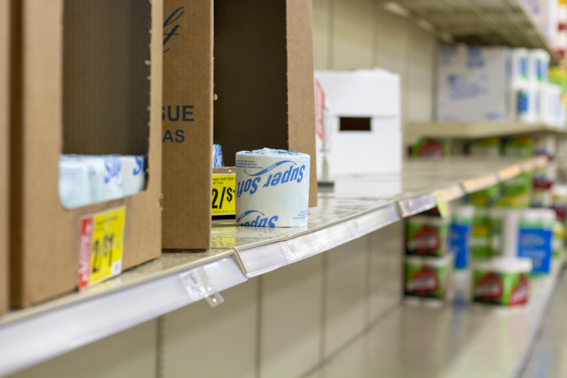 The toilet paper aisle at HEB wiped clean with just a handful of single rolls left to sell. When the World Health Organization declared the coronavirus a global pandemic, people all over the United States began emptying grocery store shelves. | Katrina Martinez/The Cougar