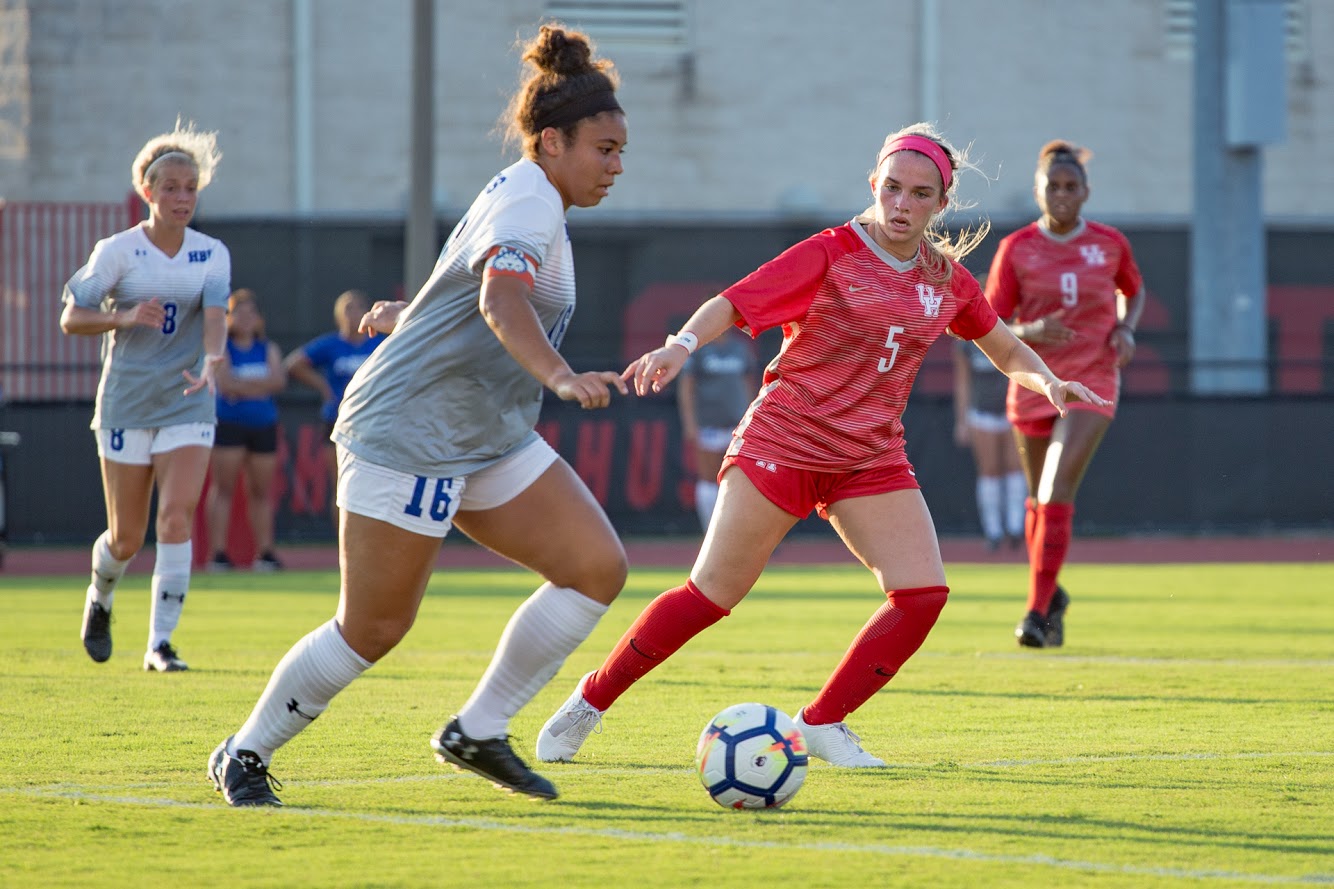 Houston sophomore midfielder Madison Gear defending a Houston Baptist player in 2019. Following its exhibition game with Rice, UH soccer will open up their regular season against the Huskies on Thursday. | Trevor Nolley/ The Cougar
