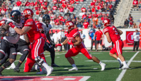 Running back Kyle Porter gets the hand-off from quarterback Clayton Tune against Cincinnati in 2019. | Trevor Nolley/The Cougar