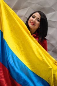 Puello holding a Colombian flag. | Courtesy of Kellin Puello