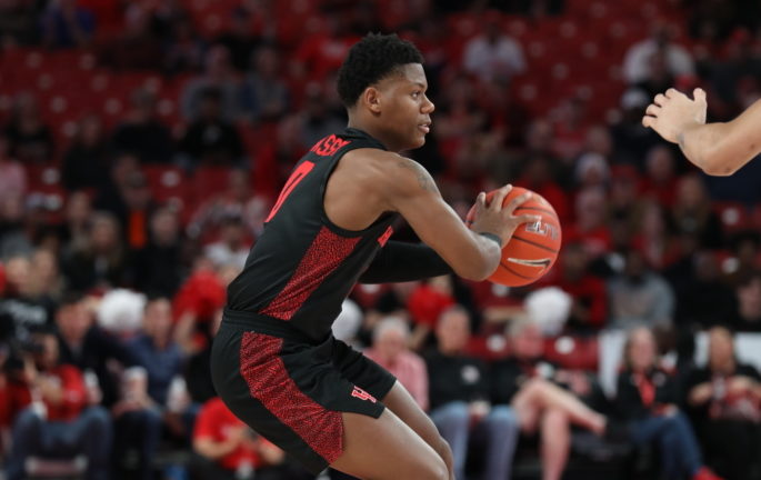 UH guard Marcus Sasser looks at the UConn defense as he looks for an open teammate during the 2019-20 season. Sasser had 25 points against Lamar in the 2020-21 season opener. | Mikol Kindle Jr./The Cougar