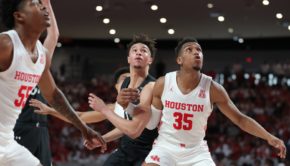 UH forward Fabian White battles with a Cincinnati player to secure a rebound in a regular season game during the 2019-20 season at Fertitta Center. | Mikol Kindle Jr./The Cougar