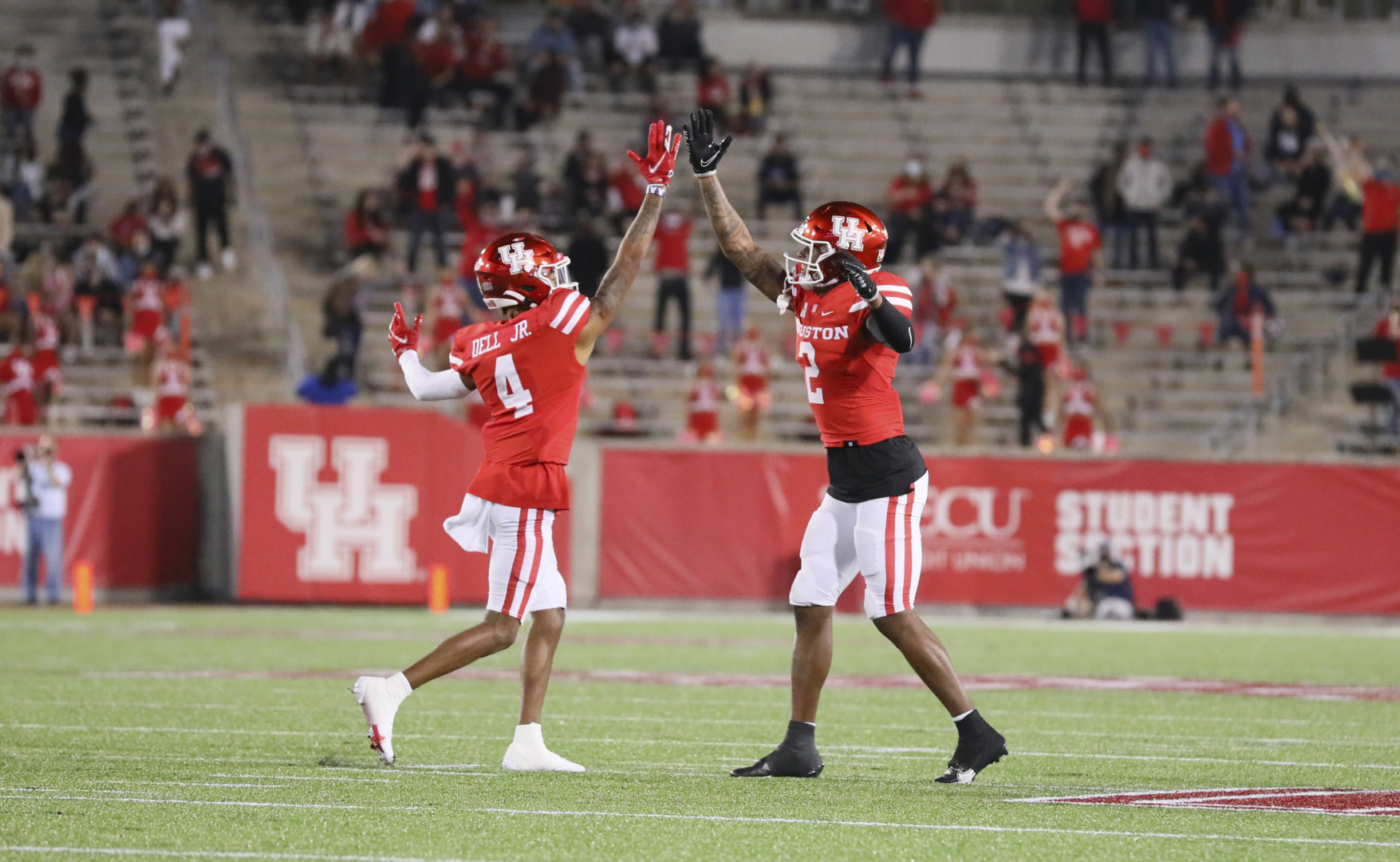 Sophomore wide receiver Nathaniel Dell and senior receiver Keith Corbin celebrate a touchdown against BYU. The Cougars fell to 2-2 in the AAC after its loss to Cincinnati. | Courtesy of UH athleticsSophomore wide receiver Nathaniel Dell and senior receiver Keith Corbin celebrate a touchdown against BYU. The Cougars fell to 2-2 in the AAC after its loss to Cincinnati. | Courtesy of UH athletics
