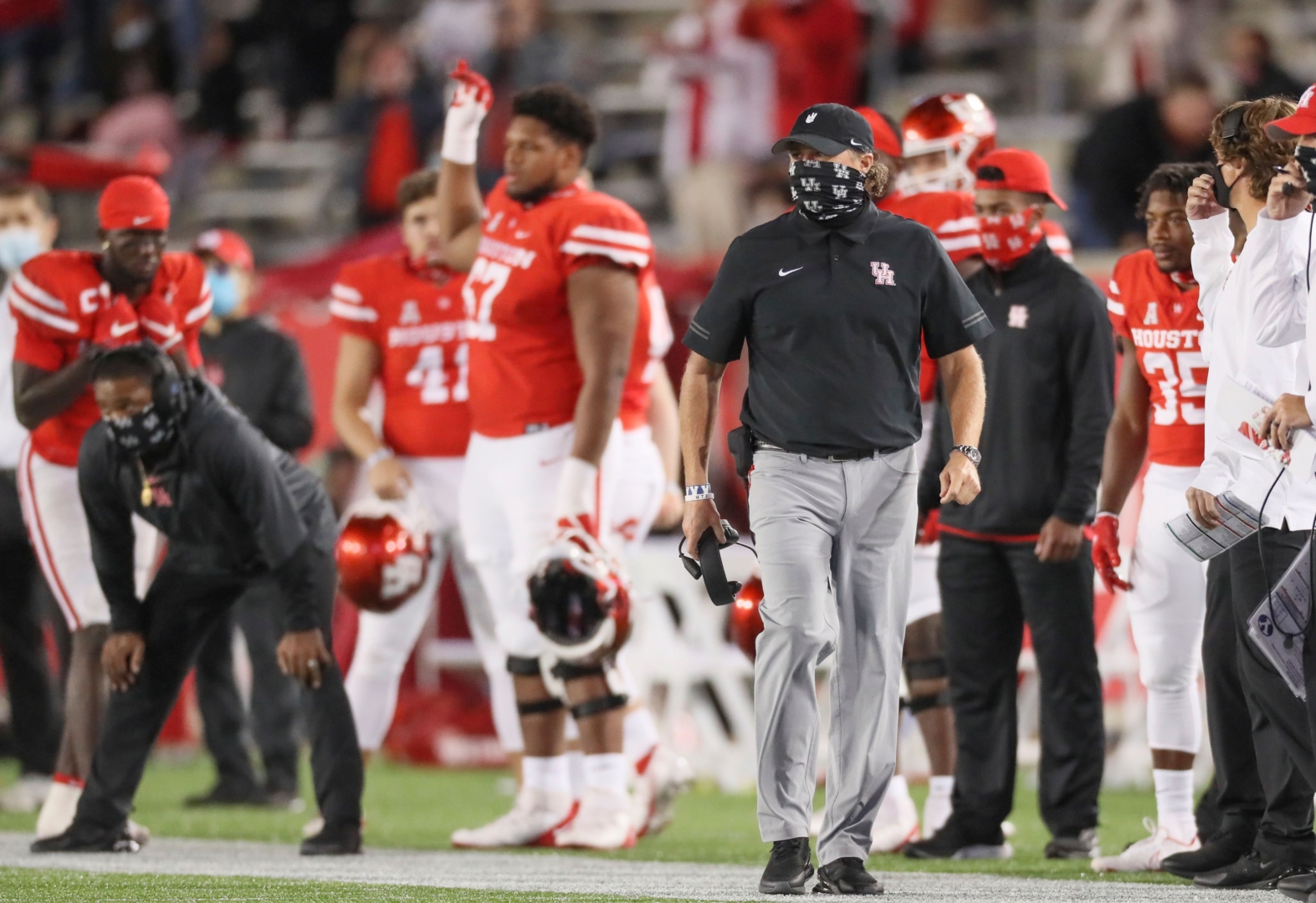 UH football head coach scans the field during the 2020 season-opening game against Tulane at TDECU Stadium. The program has now had seven games postponed due to COVID-19, with the latest coming against Tulsa. | Courtesy of UH athletics