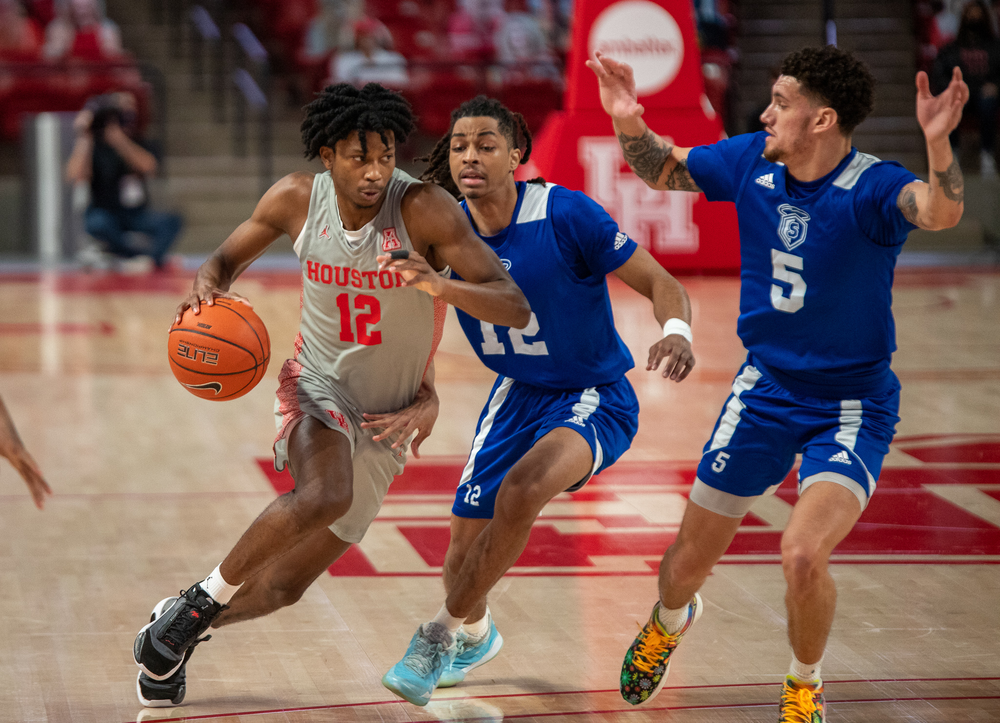 Houston men’s basketball guard Tramon Mark drives into the paint against Our Lady of the Lake on Saturday at Fertitta Center. UH dropped out of the AP Poll top five on Monday. | Andy Yanez/The Cougar