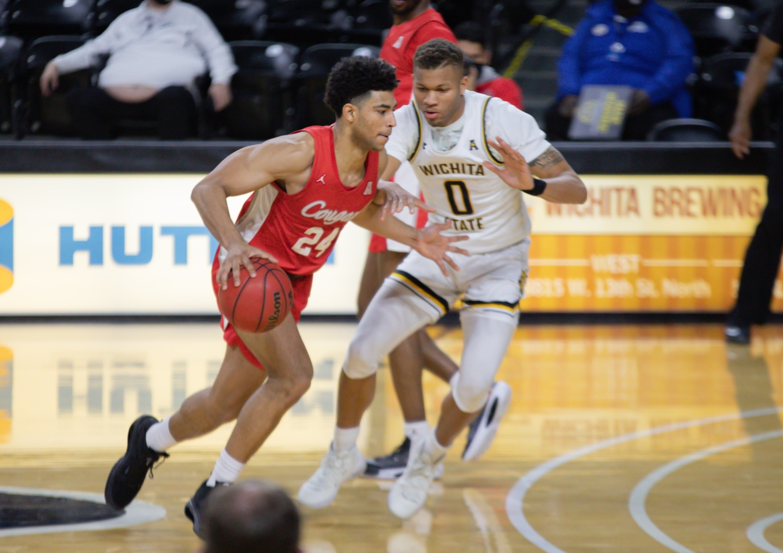 UH guard Quentin Grimes (24) drives past Wichita State guard Dexter Dennis (0) on Thursday at Charles Kock Arena. | Khanh Nguyen/The Sunflower