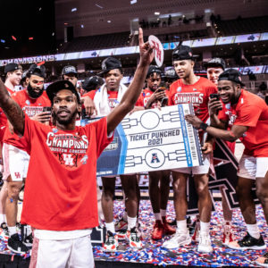 UH guard DeJon Jarreau rises his arms in celebration as the Cougars applaud their performance in winning the AAC Tournament. | Courtesy of UH athletics