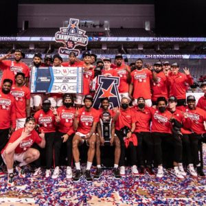 The UH basketball team celebrates winning its first American Athletic Conference Tournament Championship at Dickies Arena in Fort Worth on Sunday. UH rose up a spot in the AP Poll on Monday. | Courtesy of UH athletics