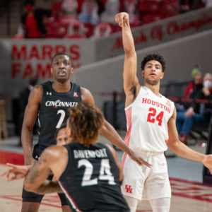 UH guard Quentin Grimes holds a pose after releasing a 3-pointer against Cincinnati on Feb. 21 at Fertitta Center. | Andy Yanez/The Cougar