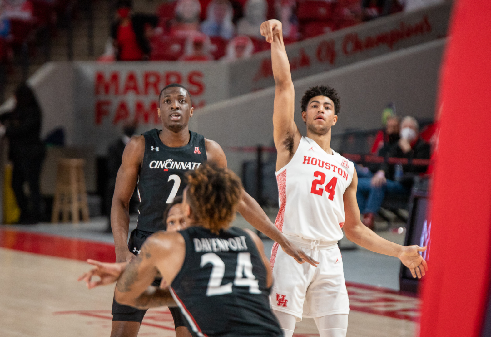 UH guard Quentin Grimes holds a pose after releasing a 3-pointer against Cincinnati on Feb. 21 at Fertitta Center. | Andy Yanez/The Cougar