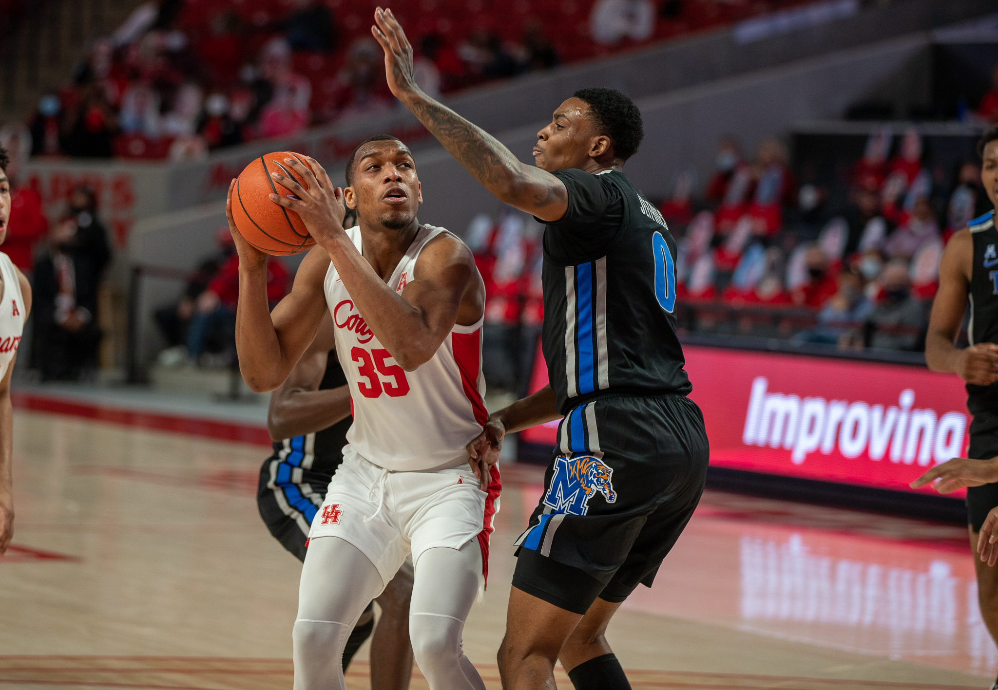 UH forward Fabian White Jr. goes up through the contact during last Sunday's game against Memphis at Fertitta Center. | Andy Yanez/The Cougar