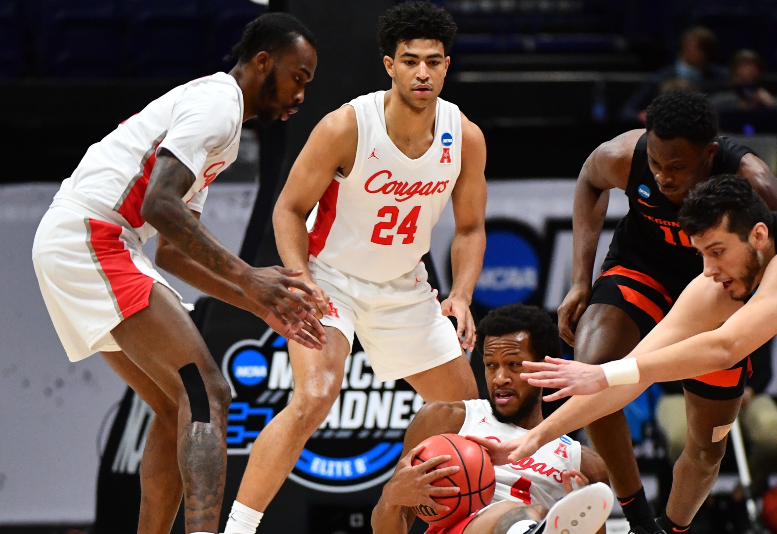 Justin Gorham (4) of the Houston Cougars fights for possession of the ball in a scrum against the Oregon State Beavers in the Elite Eight round of the 2021 NCAA Division I Men's Basketball Tournament held at Lucas Oil Stadium on March 29, 2021 in Indianapolis, Indiana. UH will play Baylor in the Final Four. | Photo by Brett Wilhelm/NCAA Photos via Getty Images