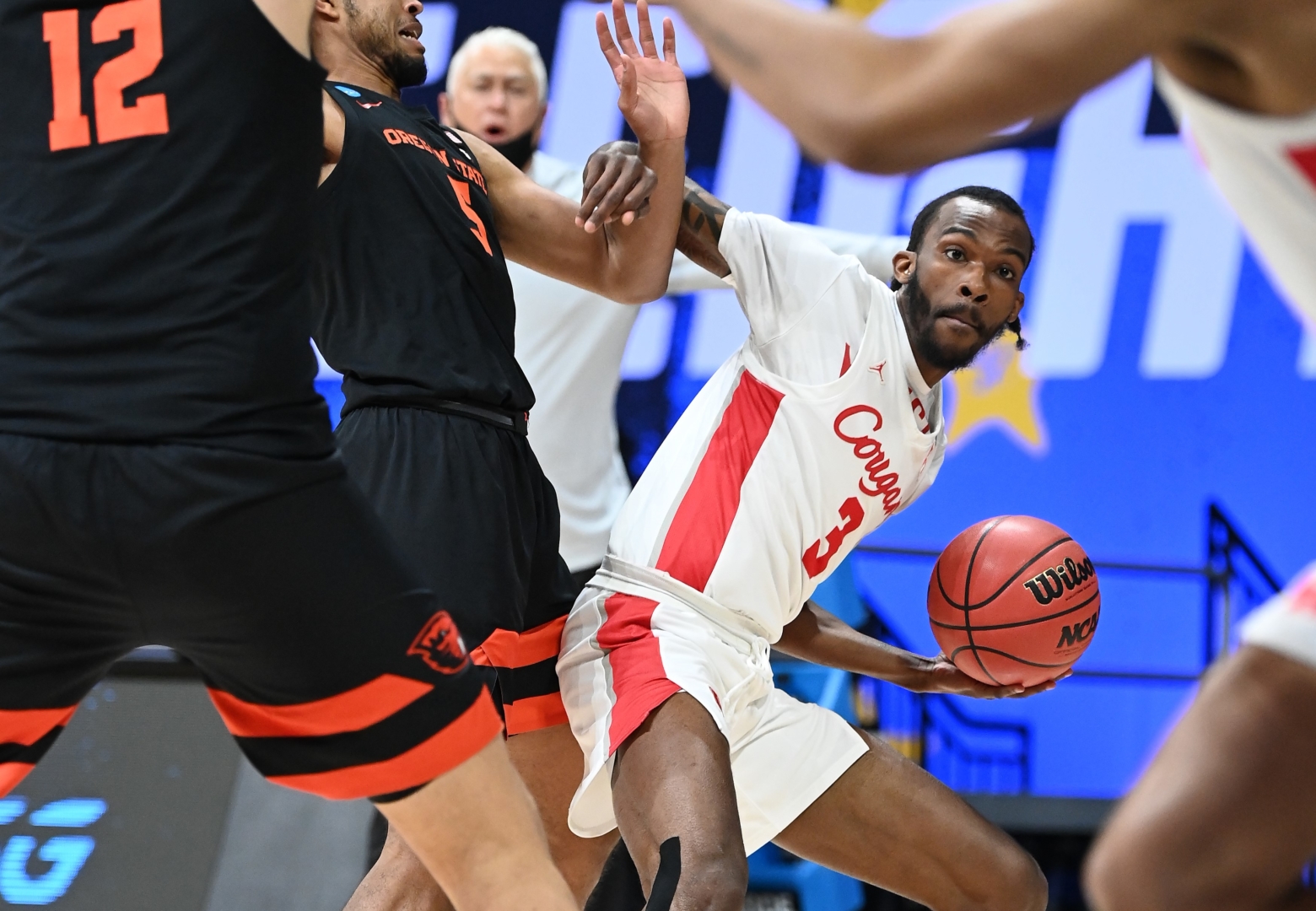 DeJon Jarreau (3) of the Houston Cougars looks to pass against the Oregon State Beavers in the Elite Eight round of the 2021 NCAA Division I Men's Basketball Tournament held at Lucas Oil Stadium on March 29, 2021 in Indianapolis, Indiana. | Photo by Brett Wilhelm/NCAA Photos via Getty Images