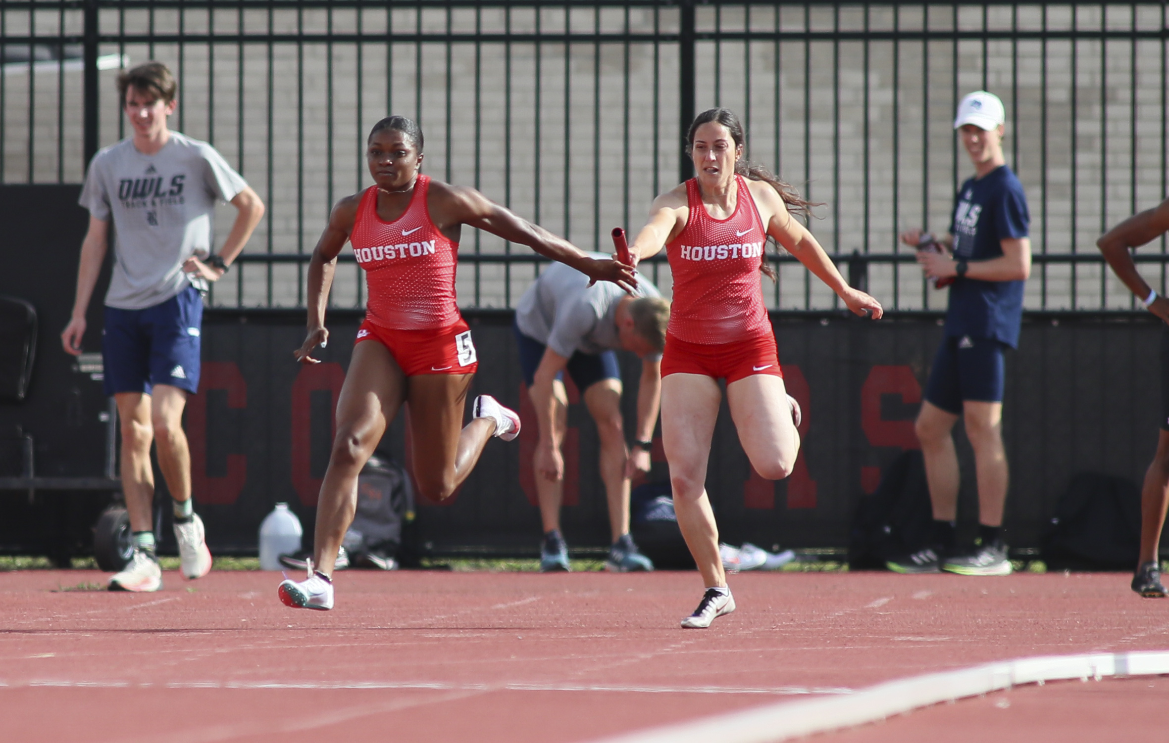 UH track and field's women's 4x100-meter relay team exchanges the baton on its way to victory in the event at the Tom Tellez Invitational. | Courtesy of UH athletics