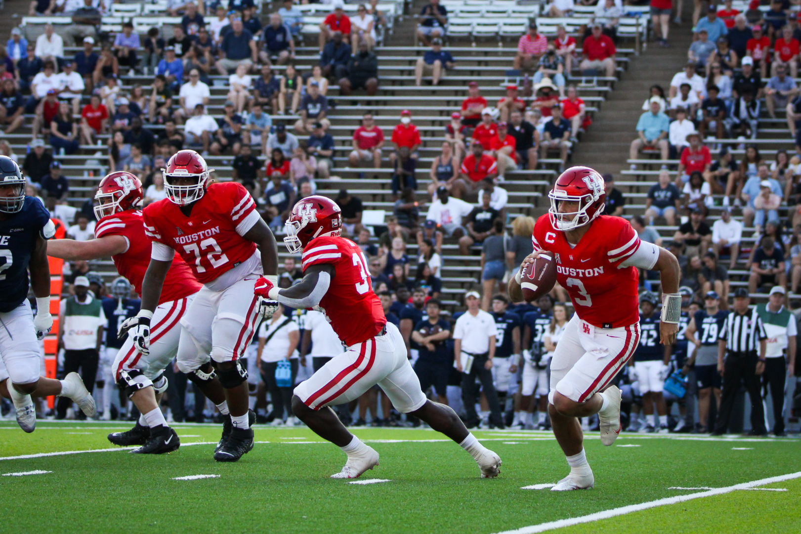 Junior quarterback Clayton Tune scrambles out of the pocket in UH football's win over Rice. | Sean Thomas/The Cougar