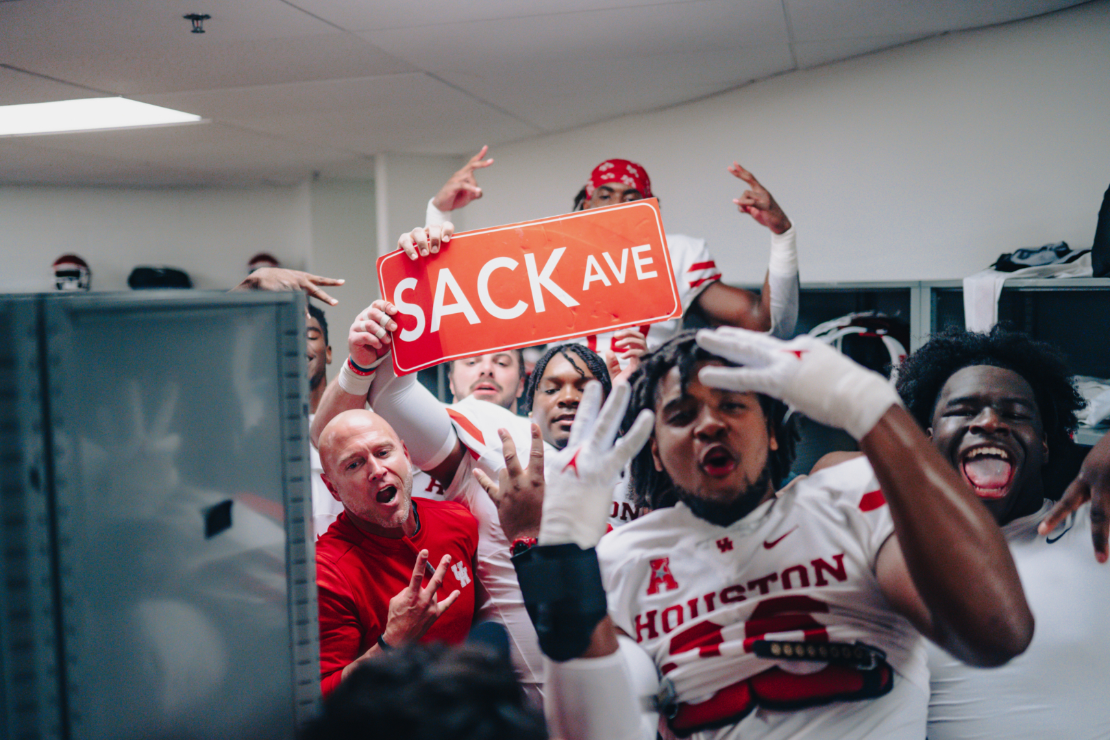 The UH defensive line poses around the Sack Avenue sign after recording eight sacks in the Cougars' victory over Tulane. | Courtesy of UH athletics