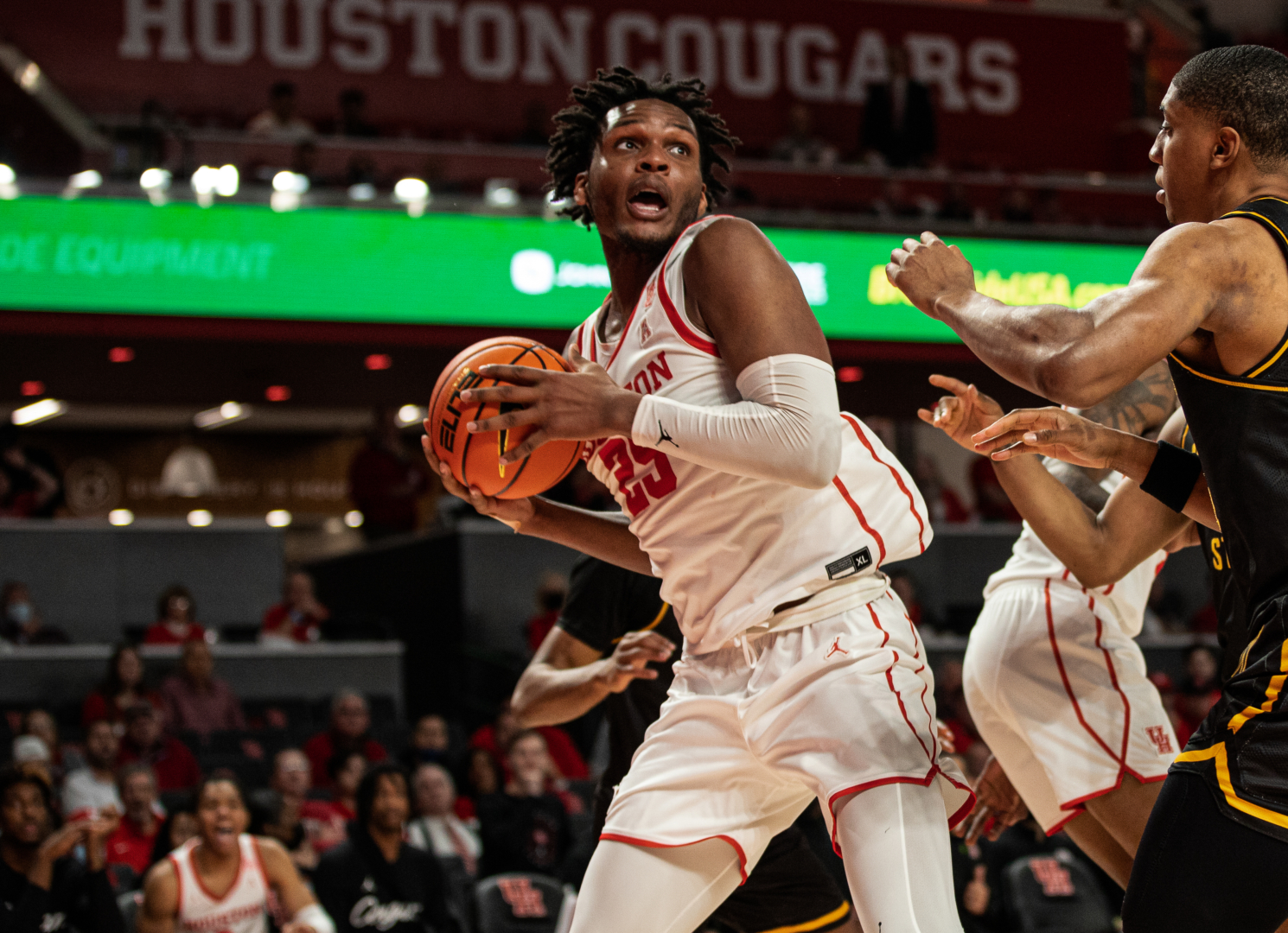 Graduate forward Josh Carlton's double-double led the way for the Cougars against UCF. | Sean Thomas/The Cougar