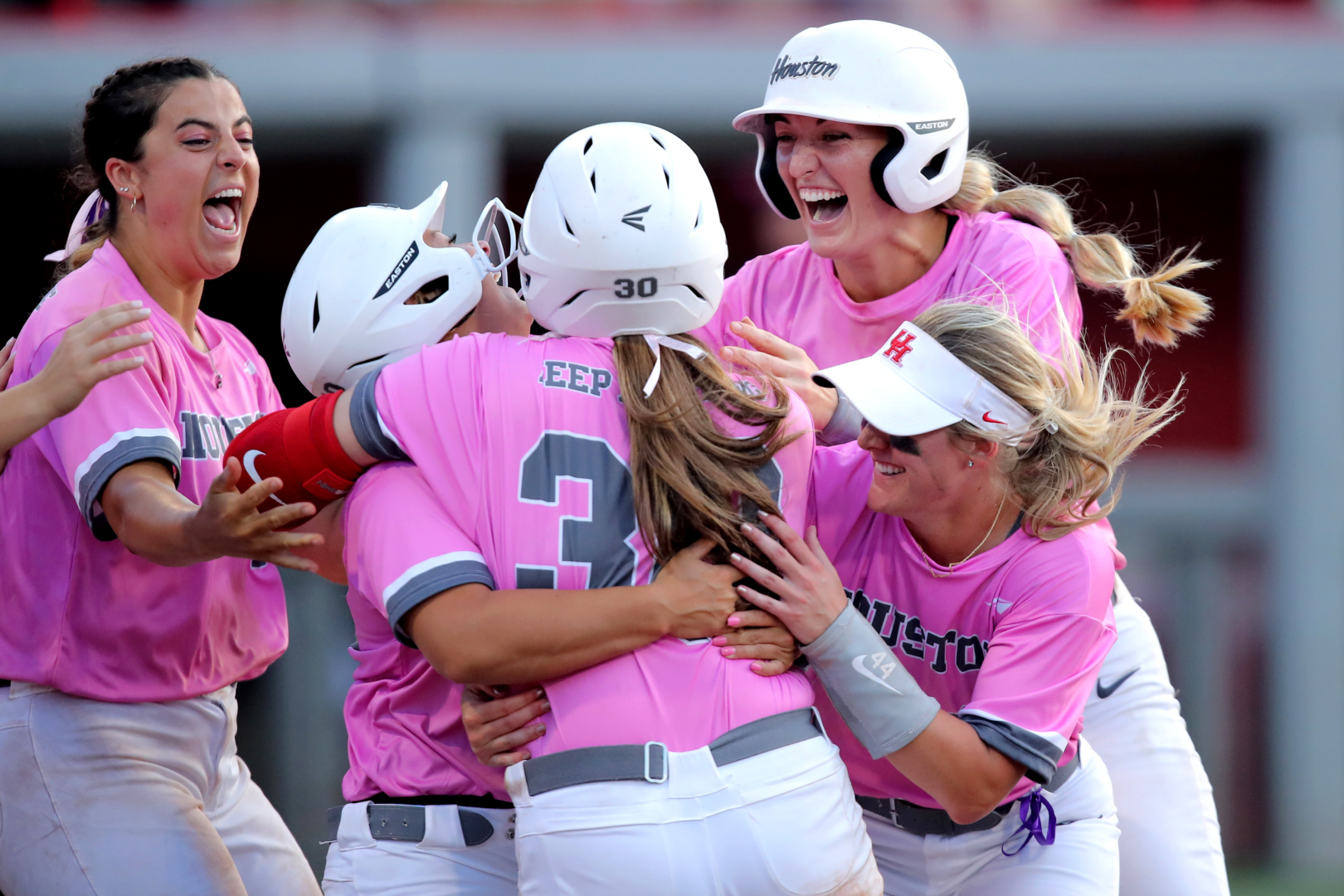 Emma Robertson is mobbed by her teammates after delivering a walk-off double to give UH softball the doubleheader sweep over Texas A&M on Wednesday afternoon. | Courtesy of UH athletics