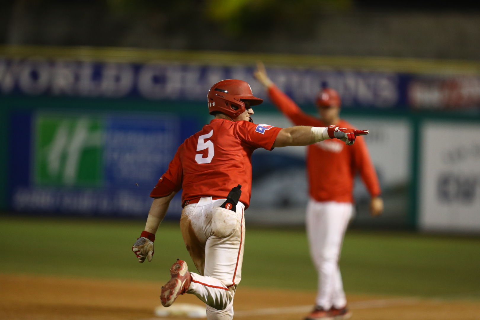 Anthony Tulimero points to the UH dugout after blasting the game-winning three-run homer in the top of the ninth on Saturday night to lift the Cougars over UCF and clinch a spot in the AAC tournament championship game. | Courtesy of American Athletic Conference/Mary Holt