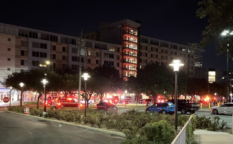 Dozens of firefighters were called to the University Lofts on Monday night after a student allegedly started a fire inside the building that damaged four floors and displaced those living inside. | Donna Keeya/The Cougar