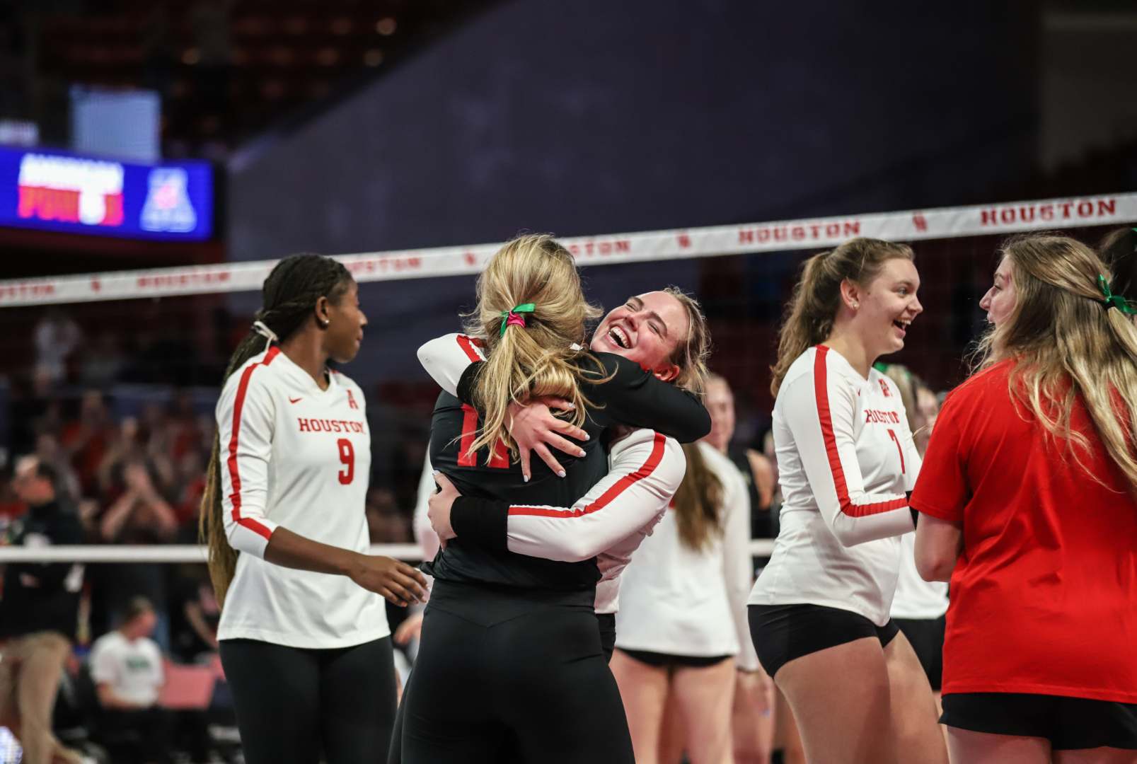 Kate Georgiades and Annie Cooke embrace after UH volleyball upset N0. 23 UCF for the program's first win over a ranked opponent since 2003. | Sean Thomas/The Cougar