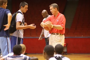 Second-year head coach James Dickey enjoys teaching campers the importance of hard word on the basketball court, but between coaching drills, he also likes to show off his 3-point shot by taking on and defeating his campers at HORSE.  | Joshua Siegel/The Daily Cougar