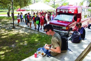 Students gather around the current food trucks by the UC. The new trucks will be where the Y Building was before its demolition.  |  File Photo/The Daily Cougar
