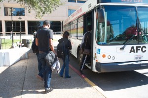 Students load the bus at the PGH circle drive. The commuter club pays 25 percent of the cost for members to ride the Metro.  |  Hannah Laamoumi/The Daily Cougar