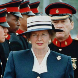 Margaret Thatcher insecting Bermudian troops in 1990 during the waning days of her premiership. The "Iron Lady," U.K. Prime Minister from 1979 to 1990, broke ground as the first woman British prime minister, privatize much of the British economy and helped end the Cold War. | Wikimedia Commons