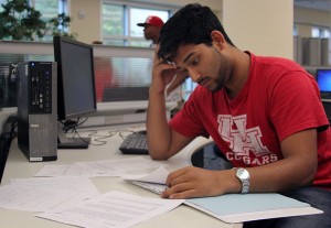 Biology sophomore Ammaar Azeem is hard at work studying in the M.D. Anderson Memorial Library. Pro tip: when studying, try to stay organized, keeping papers and handouts in order for easy access. /Mahnoor Samana/The Daily Cougar